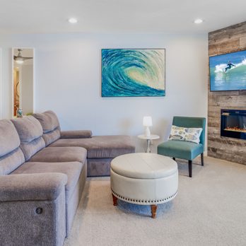 Just Beachy - Living area is spacious with electric fireplace, smart TV and beautiful art. - Vacation Rentals Near Me - Oceanside, California