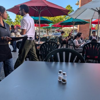 Cafe Borrone - A small section of the outdoor seating with its many tables, and brightly colored umbrellas. - Breakfast & Brunch Near Me - Menlo Park, California Cafe Borrone - A small section of the outdoor seating with its many tables, and brightly colored umbrellas. - Breakfast & Brunch Near Me - Menlo Park, California
