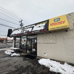Sam's Caribbean Marketplace - Store sign from the parking lot