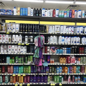 Dollar General - a grocery store shelf full of cleaning products - Discount Store Near Me - Margate, Florida
