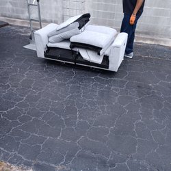 Tampa Bay Furniture & Mattress - Stains can be seen on this.loveseat and plastic was removed.