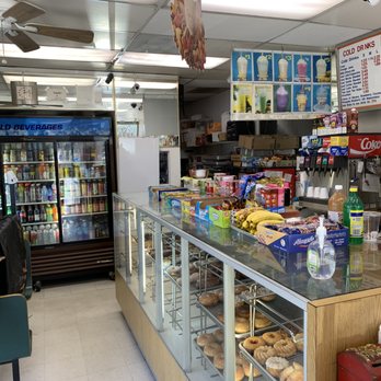 Stop In Donuts - a counter with a variety of donuts - Donuts Near Me - Van Nuys, California
