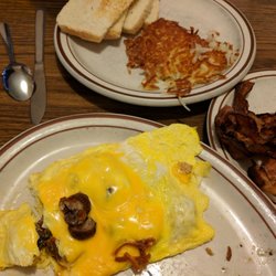 Old Main Street Cafe - He ate my hashbrowns and toast, I had the sausage omelette and we shared 2 sides of bacon. Delicious