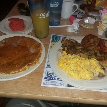 Colonial Cafe - Hungry Henry Breakfast. Scrambled eggs with cheese, home fries, and a side of sliced tomato. And OJ. - American Near Me - Elizabeth City, North Carolina