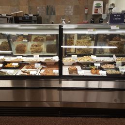 a variety of food in a display case