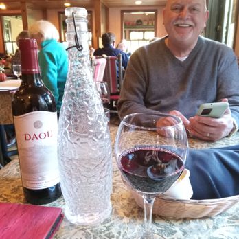 Cambria Pines Lodge Restaurant - Refilling water and wine glasses from the bottles you see here was a DIY task. - American Near Me - Cambria, California Cambria Pines Lodge Restaurant - Refilling water and wine glasses from the bottles you see here was a DIY task. - American Near Me - Cambria, California
