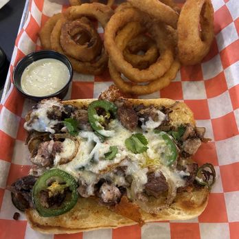 Pinballz Kingdom - Buda cheesesteak with onion rings - Arcades Near Me - Buda, Texas