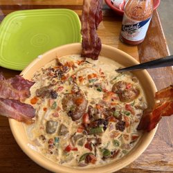 Capt Hirams Resort - Spicy shrimp and grits add a side of bacon. Awesome