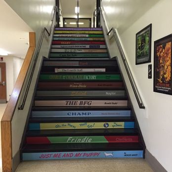 Signarama Grayslake - Stairs made to look like stacked books in an elementary schools using digital vinyl. - Signmaking Near Me - Grayslake, Illinois Signarama Grayslake - Stairs made to look like stacked books in an elementary schools using digital vinyl. - Signmaking Near Me - Grayslake, Illinois