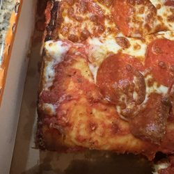 Little Caesars Pizza - So called extra cheese pizza. All the edges looked like this. No extra cheese either. Very dark.