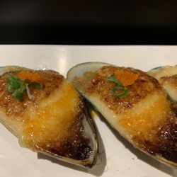 Sushi One Spot - One of our most popular dishes, Bakd green mussels topped with green onion and masago drizzled with ponzu sauce