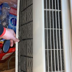 Haverkamp Properties - Air conditioner cover with debris after Haverkamp properties "cleaned" all air units prior to new tenants moving in.