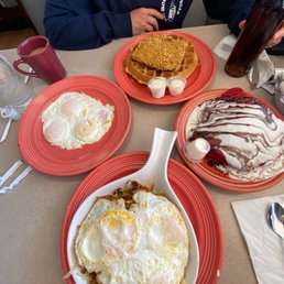 Chicken fried steak and waffle with a side of eggs, red velvet pancakes and a steak skillet! So good! Chicken fried steak and waffle with a side of eggs, red velvet pancakes and a steak skillet! So good!