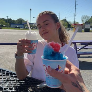 Pelican's Snoballs - a woman holding a cup of ice cream - Shaved Ice Near Me - Monroe, North Carolina