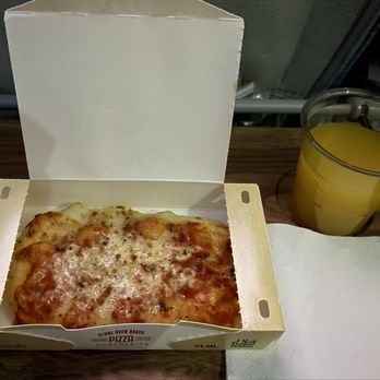 Emirates - Margherita Pizza was served as Light Bites during the flight to Dubai - Airlines Near Me - Los Angeles, California Emirates - Margherita Pizza was served as Light Bites during the flight to Dubai - Airlines Near Me - Los Angeles, California