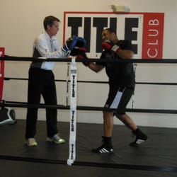 TITLE Boxing Club - Mark helping Jeremiah get ready for a fight.