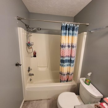 Lachcik Construction - a bathroom with a shower, toilet, and bathtub - Lawn Services Near Me - Forreston, Illinois