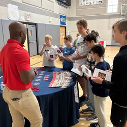 Immaculate Conception - St Joseph School - Middle school boys learning about one of the high schools that came to present at our high school fair.