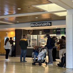 McDonald's - Right side of the picture is a worker walking the order out