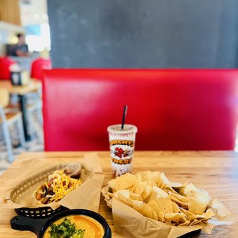 Torchy's Tacos - green chile queso | chips | fajita taco | drink - Tacos Near Me - San Antonio, Texas Torchy's Tacos - green chile queso | chips | fajita taco | drink - Tacos Near Me - San Antonio, Texas