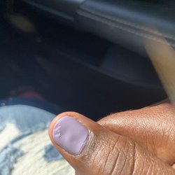 Modern Nails & Spa - Messed up polish on thumbnail that the tech supposedly fixed.