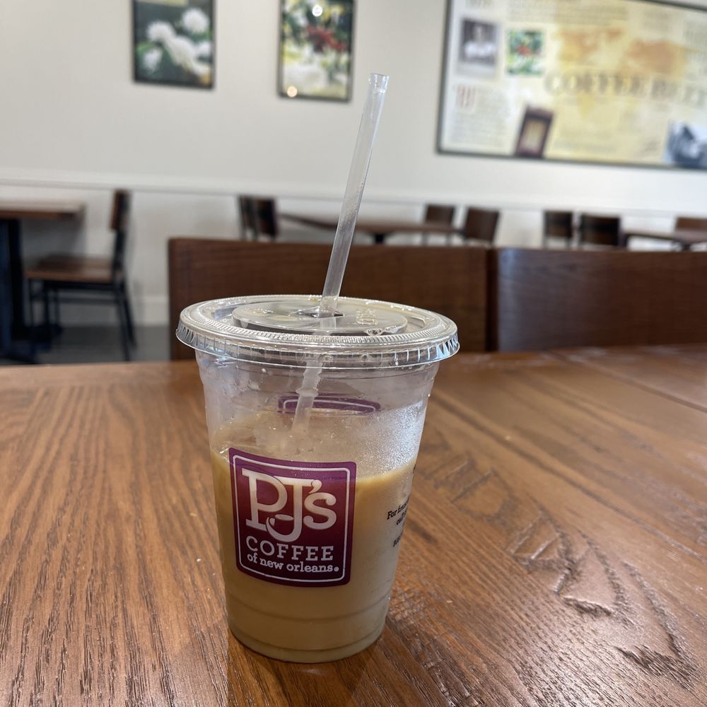PJ's Coffee - a cup of coffee on a table - Coffee & Tea Near Me - Pensacola, Florida PJ's Coffee - a cup of coffee on a table - Coffee & Tea Near Me - Pensacola, Florida