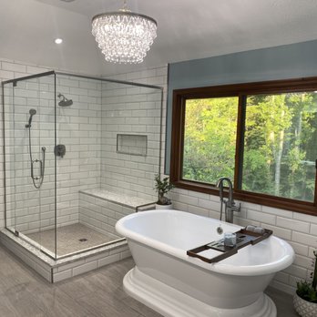 Keith's Kitchens - a bathroom with a tub and shower - General Contractors Near Me - Winfield, West Virginia Keith's Kitchens - a bathroom with a tub and shower - General Contractors Near Me - Winfield, West Virginia
