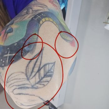 Love N Hate Elite Tattoo Studio - Shading under snake we never discussed. Blown out lines and poor line work - Tattoo Near Me - Lakewood, Colorado Love N Hate Elite Tattoo Studio - Shading under snake we never discussed. Blown out lines and poor line work - Tattoo Near Me - Lakewood, Colorado
