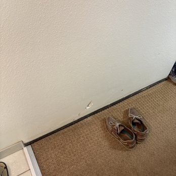 Gateway Inn - A big dent in the wall near the tiled sink area of the room. - Hotels Near Me - Lyman, Wyoming