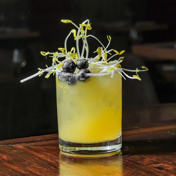 Chelo - a yellow cocktail with blueberries on the rim - Persian/Iranian Near Me - Roswell, Georgia Chelo - a yellow cocktail with blueberries on the rim - Persian/Iranian Near Me - Roswell, Georgia