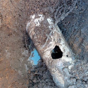 A J Plumbing - Before of a 4" PVC drain pipe with a hole in it. - Plumbing Near Me A J Plumbing - Before of a 4" PVC drain pipe with a hole in it. - Plumbing Near Me
