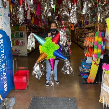 Dulceria Socami - a woman holding a bunch of balloons - Candy Stores Near Me - Sacramento, California