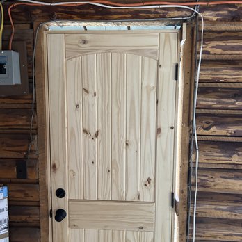 Southern Country Solutions - a door in a log cabin - Flooring Near Me Southern Country Solutions - a door in a log cabin - Flooring Near Me
