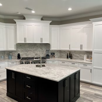 Accurate Cabinet Refacing - Wood Doors Finished in a Classic White and Black Island. - Cabinetry Near Me - Naples, Florida Accurate Cabinet Refacing - Wood Doors Finished in a Classic White and Black Island. - Cabinetry Near Me - Naples, Florida