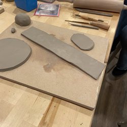 Muddy Waters Studio - Clay pieces starting to take the shape of a bowl
