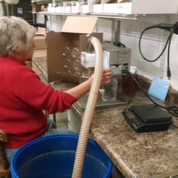 Windmill Hill Farm - Carol Ragan bottling creamed honey