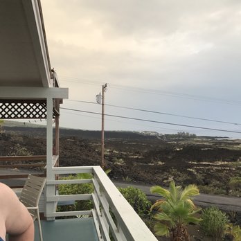 Cottage with a View - Part of the seating area and looking south toward Milolii, HI. - Guest Houses Near Me - Captain Cook, Hawaii