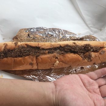 CC Peppers - a hand holding a hot dog - Fast Food Near Me - State College, Pennsylvania CC Peppers - a hand holding a hot dog - Fast Food Near Me - State College, Pennsylvania