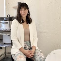 Hi! It's me, Lindaluz! Here I am sitting in my office at the HHC. I specialize in myofascial bodywork, and nervous system regulation.