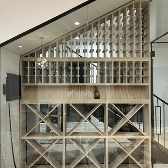 ERCC Dallas - a wine rack in the middle of a room - General Contractors Near Me