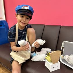 The Busy Bee Play Cafe - Mailman weighing the goods