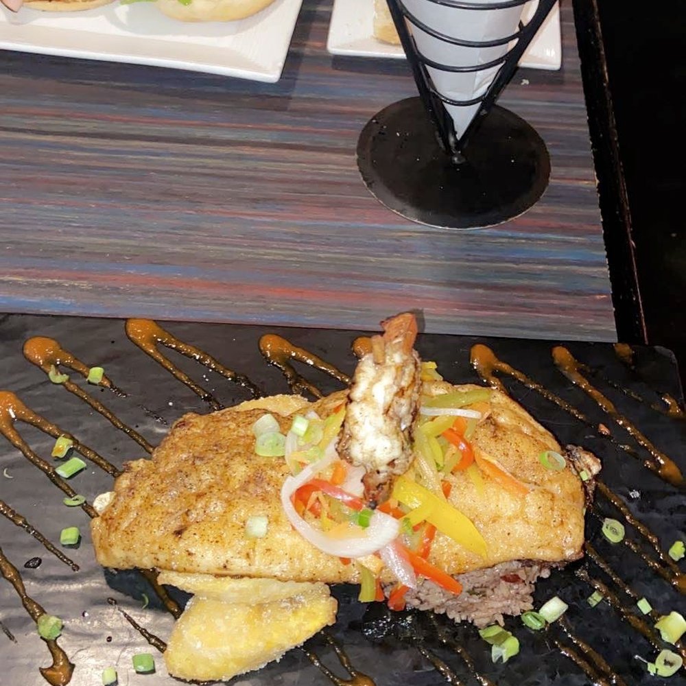 Sisserou's Caribbean Restaurant & Catering - Red Snapper- 2 jumbo shrimp, plantains, and rice and peas - Caribbean Near Me - Tulsa, Oklahoma Sisserou's Caribbean Restaurant & Catering - Red Snapper- 2 jumbo shrimp, plantains, and rice and peas - Caribbean Near Me - Tulsa, Oklahoma