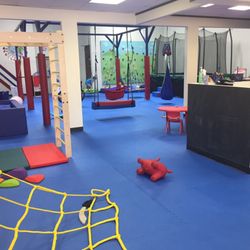 View of the gym! Rope wall, rock wall, zipline, suspended swings and more!