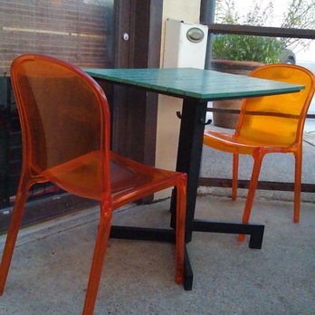 Sundown at Granada - Clear Plastic Orange Chairs - New American Near Me - Dallas, Texas Sundown at Granada - Clear Plastic Orange Chairs - New American Near Me - Dallas, Texas