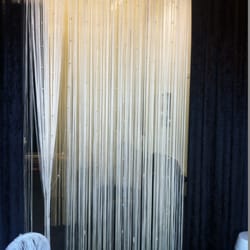Holy Lashes - Beaded curtain separating the waiting area