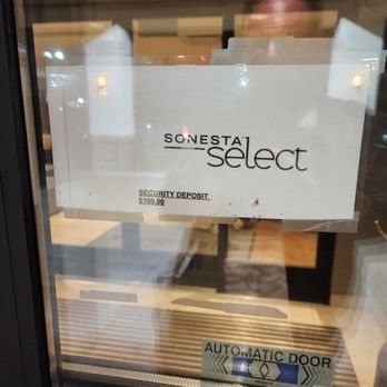 Sonesta Select Durham Research Triangle Park - This sign is taped up in the window of the entry area. Look closely and it announces "Security Deposit $100." - Hotels Near Me - Durham, North Carolina Sonesta Select Durham Research Triangle Park - This sign is taped up in the window of the entry area. Look closely and it announces "Security Deposit $100." - Hotels Near Me - Durham, North Carolina