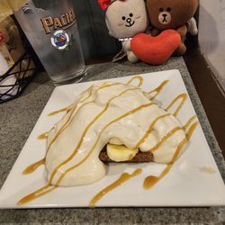 Irish Cottage Inn - Banoffee Pie: Graham cracker crust, slices of banana, and homemade coffee, topped with fresh coffee cream and caramel drizzle... delicious!