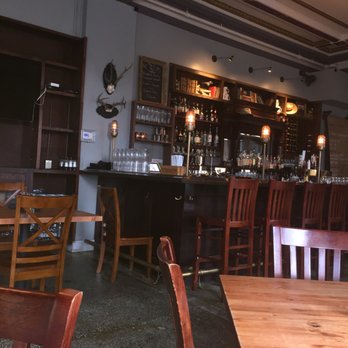 The Gryphon - Very old men's club style bar and restaurant - dark wood and leather couches - New American Near Me - Burlington, Vermont The Gryphon - Very old men's club style bar and restaurant - dark wood and leather couches - New American Near Me - Burlington, Vermont