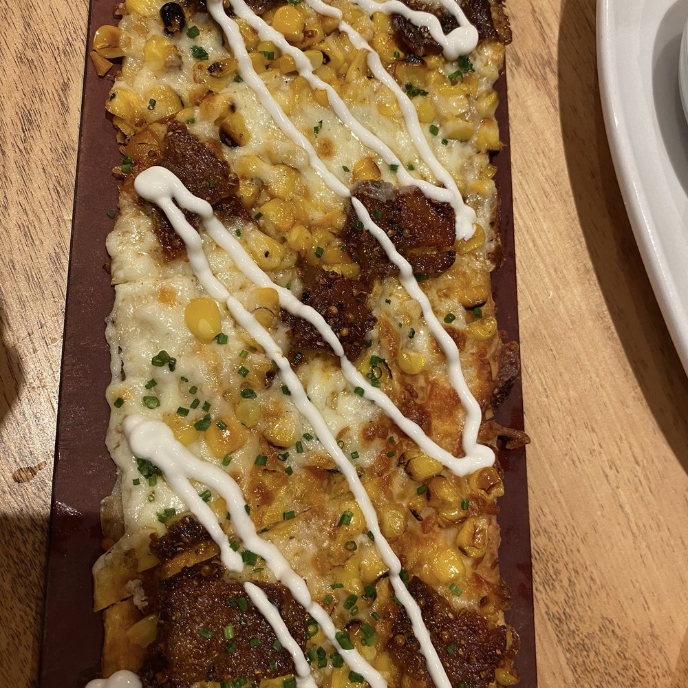 Seasons 52 - WOOD-GRILLED CORN, AGED CHEDDAR AND SPICED BACON FLATBREAD - New American Near Me - Mclean, Virginia Seasons 52 - WOOD-GRILLED CORN, AGED CHEDDAR AND SPICED BACON FLATBREAD - New American Near Me - Mclean, Virginia