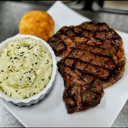 Rob’s Rum Kitchen - 12 oz ribeye with buttery mashed potatoes.